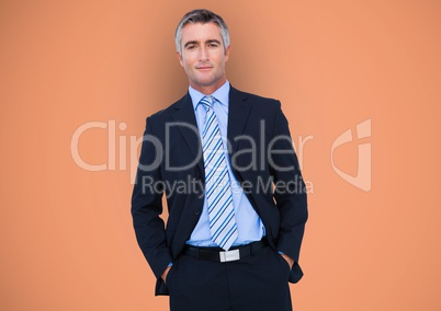 Confident businessman with hands in pockets