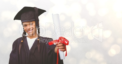 Graduate girl showing certificate over bokeh
