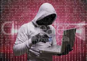 Grey jumper hacker with the computer and the credit card