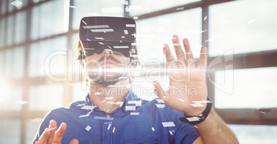 Digital composite image of businessman wearing VR glasses