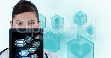 Digital composite image of doctor showing medical signs on tablet PC