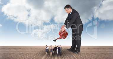 Digital composite image of manager watering executives on boardwalk