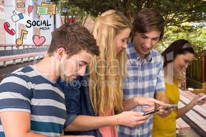 Happy friends using social media on smart phones