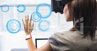 Businesswoman looking at circle on VR glasses