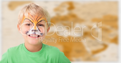 Boy with facepaint against blurry brown map