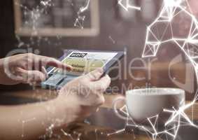 Hands in cafe with tablet and white network overlay
