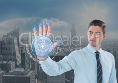 Business man with hand scan in front of the city