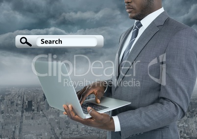 Businessman holding laptop with Search Bar with city background