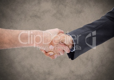 Handshake against brown grunge background