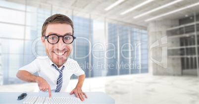 Digital composite image of happy nerd using computer keyboard