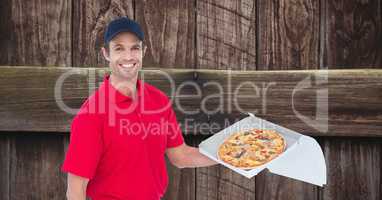 Delivery man holding pizza in box