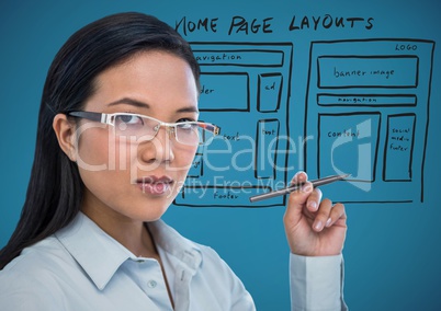 Business woman with pen and website mock up against blue background