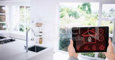 Hands using smart home app in kitchen