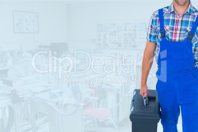 Composite image of man holding a toolbox