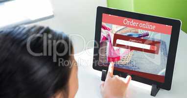 Cropped image of person shopping online using tablet PC