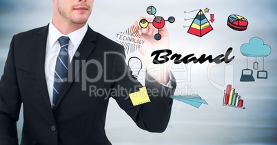 Business man mid section with marker and brand doodles with flare against blurry grey wood panel