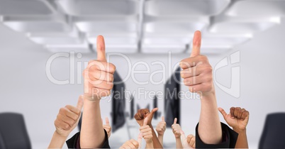 Business people's hands showing thumbs up