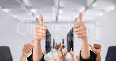 Business people's hands showing thumbs up