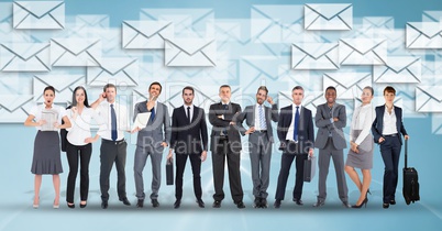 Digitally generated image of business people with envelop icons flying in background