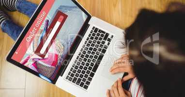 Woman using laptop with search window on screen