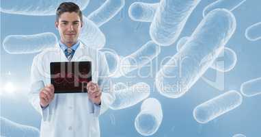 Portrait of male doctor showing DNA structure in tablet computer with microorganism structure in bac