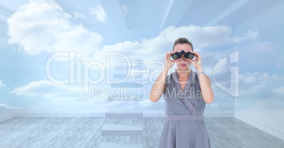 Digital composite image of businesswoman looking through binoculars against sky