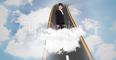 Digital composite image of businesswoman standing on highway in sky