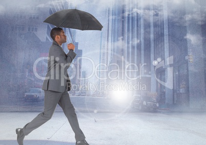 Businessman walking with umbrella in city