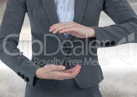 Businessman holding invisible object with sea background