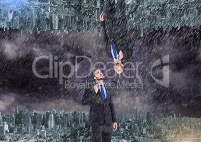 up side down city. raining. Business men with umbrella