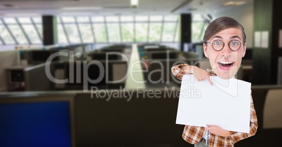 Happy nerd pointing at blank placard in office