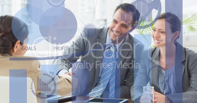 Digitally generated image of various graphs and icons with business people in office