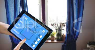 Hands using smart home application on tablet PC