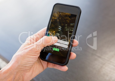 Hand with phone and login screen
