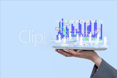 Digital composite image of employees and graphs overs tablet computer held by businessman against bl