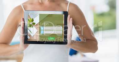 Midsection of woman showing digital tablet with signup screen