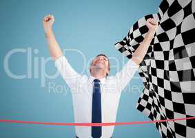 Business man at finish line against blue background and checkered flag