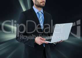 man on laptop with dark virtual background