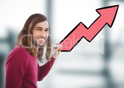 Man with pen against arrow and blurry grey office