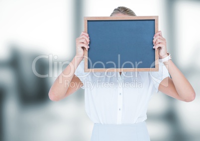 Business woman with blackboard in front of the head.