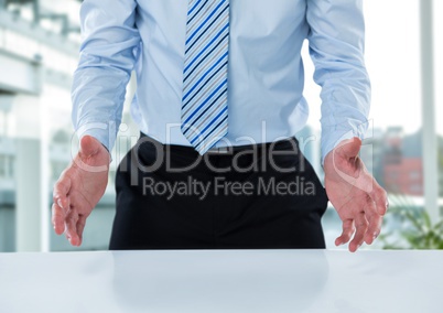 Composite image of smiling businessman standing