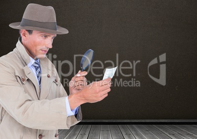 Detective with magnifying glass in front of blackboard