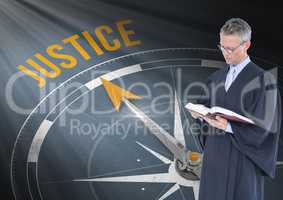 Judge holding book in front of justice text and compass