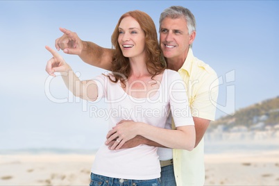 Affectionate couple gesturing while standing at beach