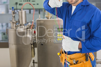 Midsection of worker working in workshop