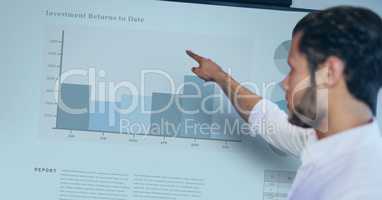 Side view of businessman pointing at graph