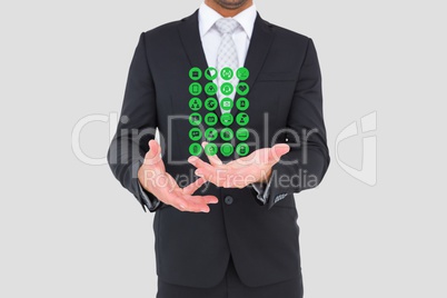 Midsection of businessman with medical icons