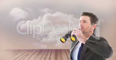 Digital composite image of businessman holding binoculars while looking away