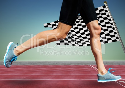 Runner legs on track against blue green background and checkered flag