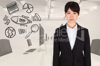 Digitally generated image of businesswoman standing by various icons in office